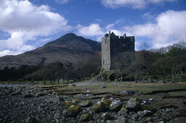 SCOTLAND, Argyll and Bute, Isle of Mull, "Moy Castle on the shores of Loch Bui, mountain peak behind. "