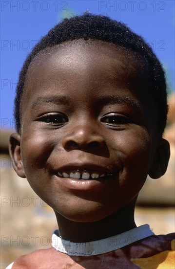 SOUTH AFRICA, KwaZulu Natal, Mpumalanga, Portrait of a young Ndebele boy in Botshabelo near Middelbutg