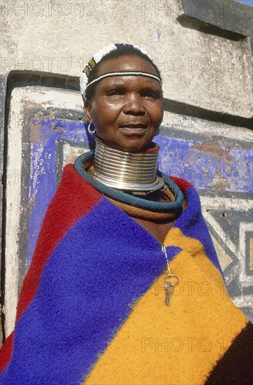SOUTH AFRICA, KwaZulu Natal, Mpumalanga, Portrait of an Ndebele woman in traditional dress and wearing a large necklace at Botshabelo near Middelburg