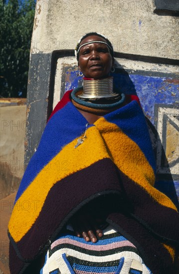 SOUTH AFRICA, Mpumalanga, Botshabelo, "Near Middleburg, local woman in traditional dress inc. large necklace. "