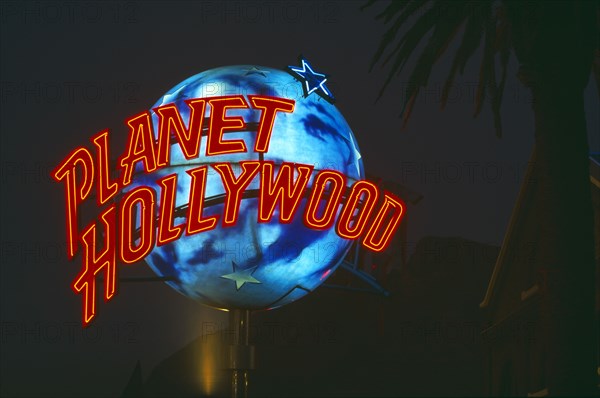 SOUTH AFRICA, Cape Town, "V&A Waterfront, a rotating 'Planet Hollywood' logo infront of new resturant taken at night.  "