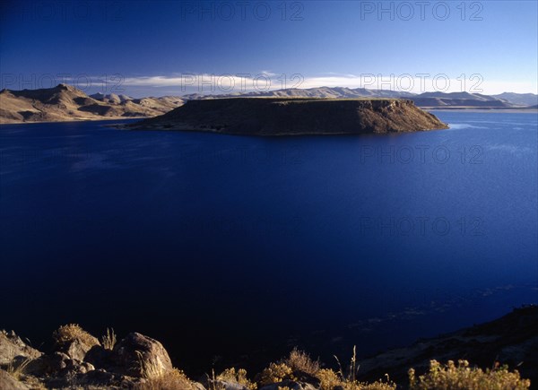 PERU, Puno Administrative Department, Sillustani, Lake Ayumara with island in the centre of the blue water