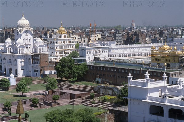 INDIA, Punjab, Amritsar , Golden Temple complex and surrounding city buildings.
