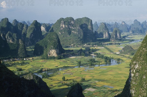 CHINA, Guangxi, Near Guilin , View from Moonhill with Karst limestone formations around the river valley with rice paddies