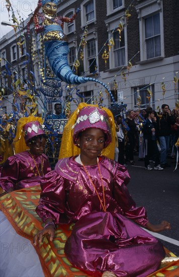 ENGLAND, London,  Girls in pink Arabian style costumes at the Notting Hill carnival