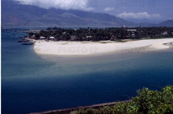 VIETNAM, Lang Co, View over beach and lagoon with moored boats