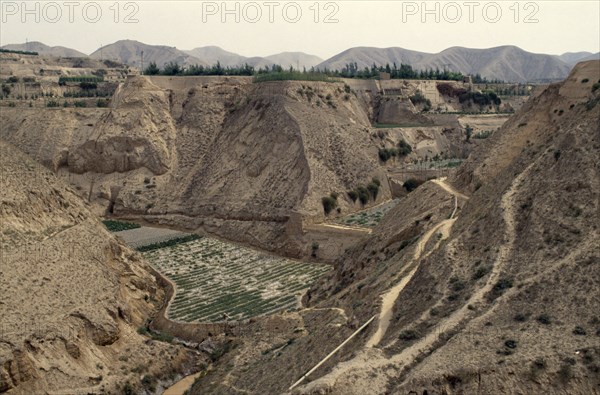 CHINA, Gansu, Lanzhou , Loess eroded valleys and terracing for crops.