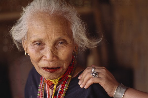 THAILAND, North, Chang Ria, Portrait of an elderly Karen Refugee woman with a younger womans hand on her shoulder