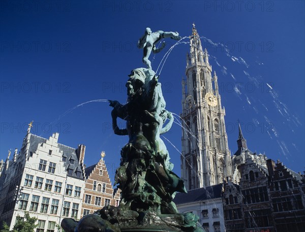 BELGIUM, Flemish Region, Antwerp, "The Brabo Fountain, tower of Our Lady's Cathedral & Main Square, Grote Markt facade."