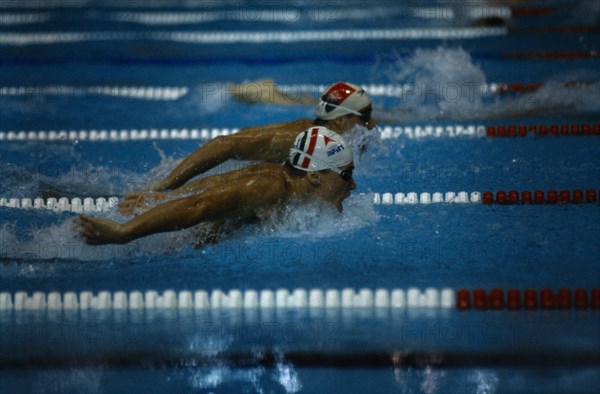 10086662 SPORT Water Swimming Male swimmers doing butterfly stroke in world student games.