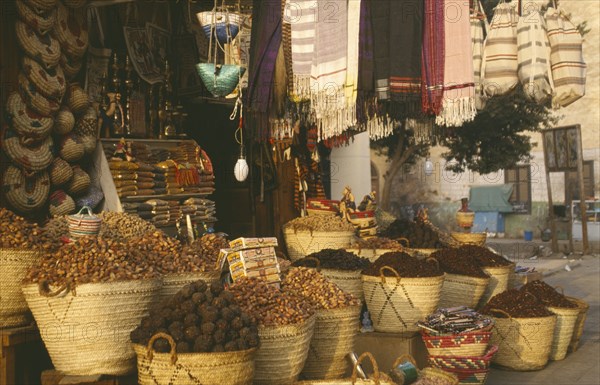 EGYPT,  , Luxor, Date and souvenir shop with straw baskets on pavement