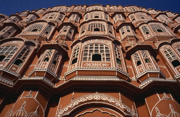 INDIA, Rajasthan, Jaipur , Hawa Mahal or Palace of the Winds. View looking up at the pink facade of the Rajput style architecture