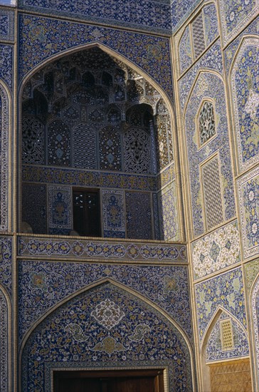 IRAN, Esfahan, Mosque detail of ornate walls and archways Esfahan Isfahan