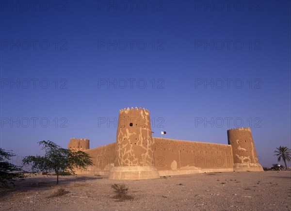 QATAR, Zubara, "Exterior view of a fort with crenellated towers, built in 1938 and used as a police border post, now a museum.  "