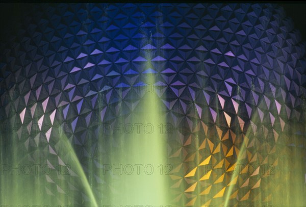 USA, Florida, Orlando, Walt Disney World Epcot Center Spaceship Earth illuminated at night through fountain