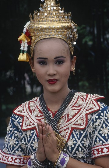 THAILAND, Bangkok, Erewan Shrine Temple Dancer giving a traditional Thai Wai greeting