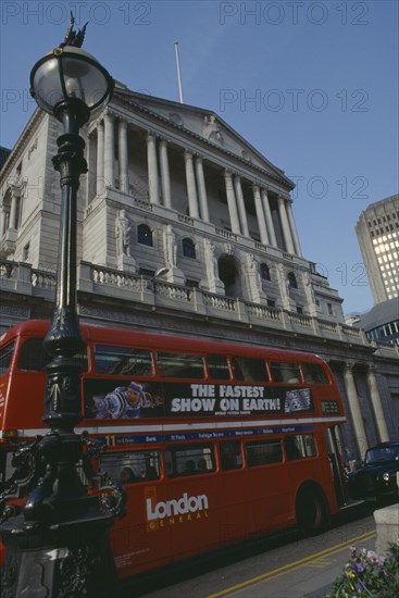 ENGLAND, London, "Bank of England building in Threadneedle street, with red routemaster bus in the foreground."