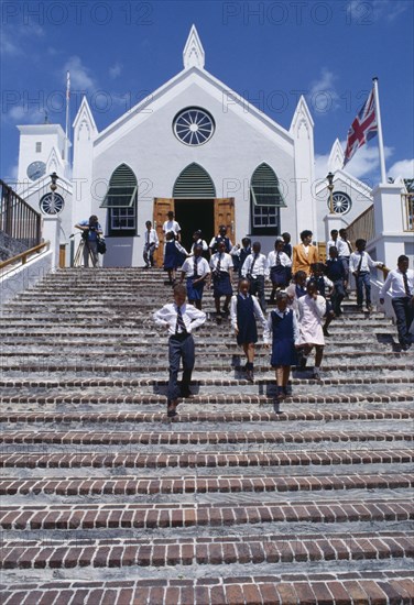 BERMUDA, St Georges Island, St Georges, Schoolchildren in uniform leaving St. Peters Cathedral.