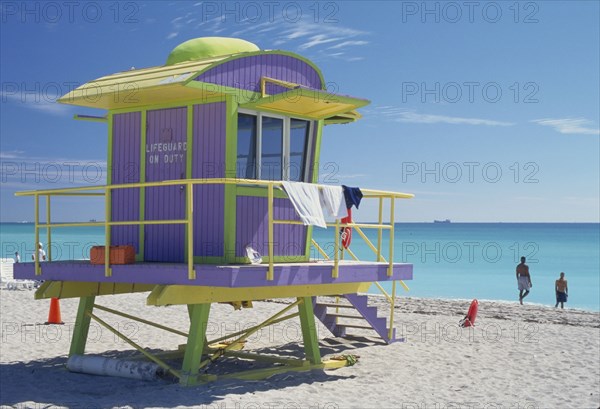 USA, Florida, Miami, Yellow green and lilac lifeguard hut on Miami beach