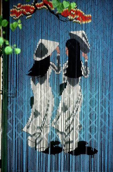 VIETNAM, Danang , Detail of curtain on riverside cafe door.