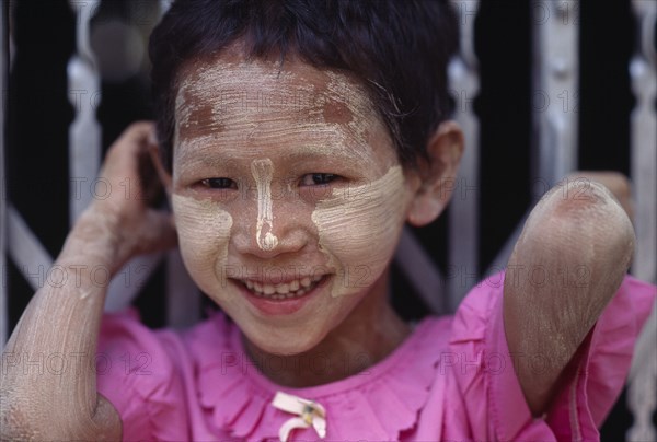 MYANMAR, Portraits, Children, Portrait of young girl wearing skin protection made from tree bark.