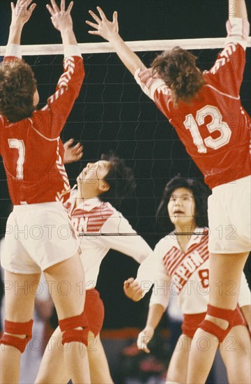 SPORT, Ball Games , Volleyball , Players leaping for ball at net in Norway versus Japan match.