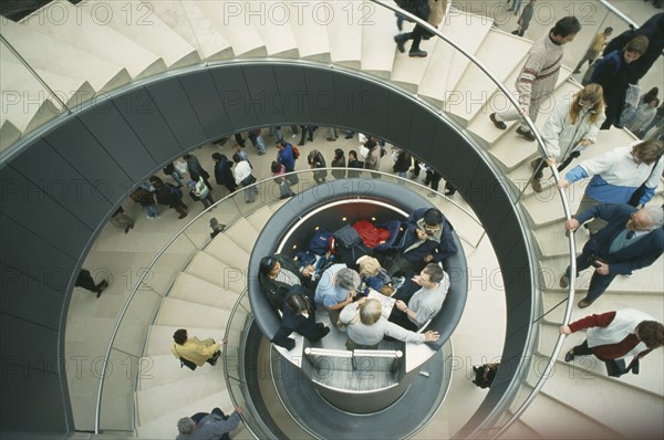 FRANCE, Ille de France, Paris, The Louvre interior. View looking down spiral staircase to central hydraulic lift