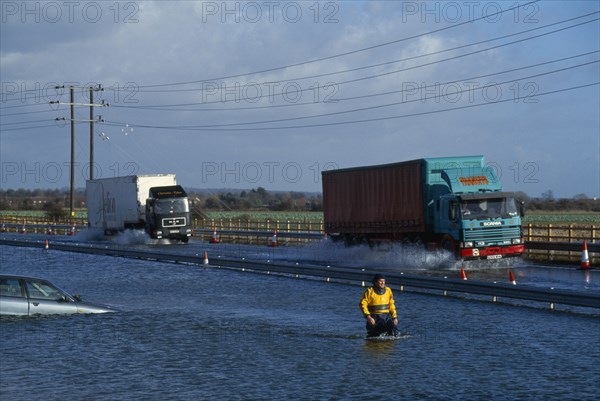 WEATHER , Rain, Flooding , Chichester by-pass with traffic driving through flood water