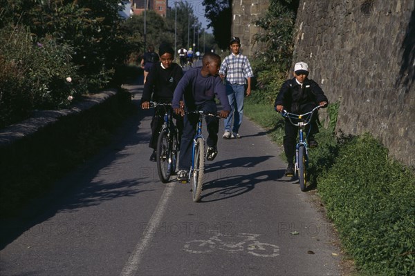 10060124 CHILDREN Leisure Cycling Boys on cycle path in Bristol  England