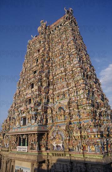 INDIA, Tamil Nadu, Madurai , "Sri Meenakshi Temple, exterior of the West Tower showing elaborate carvings."