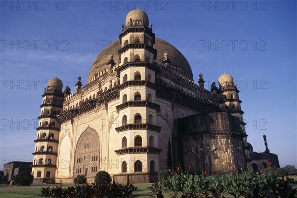 INDIA, Karnataka  , Bijapur, "The Golgumbaz, mausoleum of Mohammed Adil Shah built in 1659.  Exterior view with corner towers and domed roof."