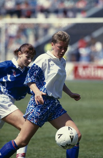 10067474 SPORT Ball Games Football Two female footballers playing during an international match between England and Iceland