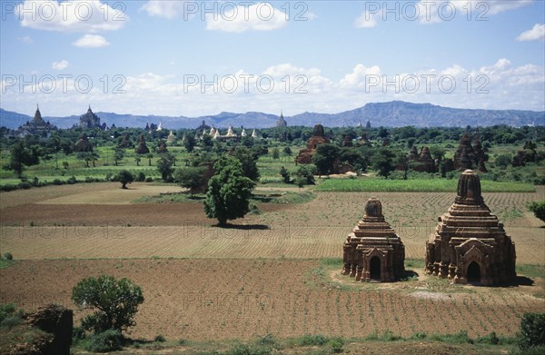 BURMA, Pagan, Two Temples in a field with others seen in the distance