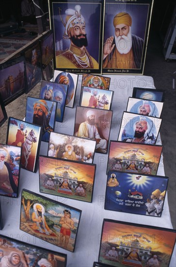 INDIA, Punjab, Amritsar, Souvenir pictures of Sikh gurus for sale.