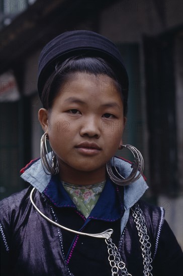 VIETNAM, North, Sa Pa, Portrait of Muong girl wearing large hooped earrings