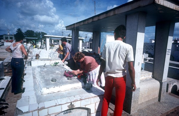 CUBA, Ciego de Avila, Moron, People visiting the graveyard on Fathers Day