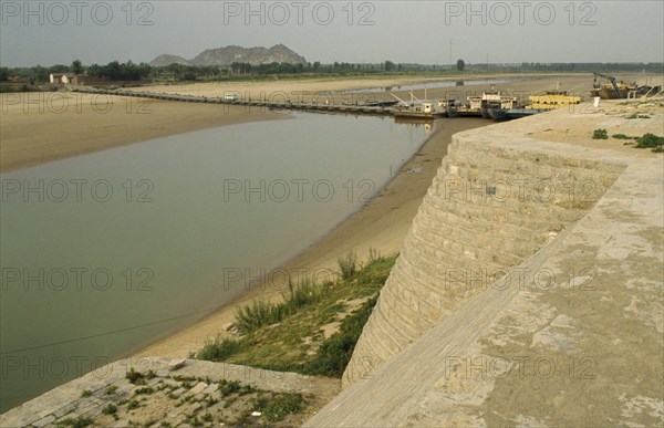 CHINA, Yellow River, View over river and dykes after upstream irrigation leaving only shallow water.