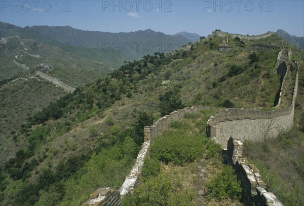 CHINA, Mutianyu, The Great Wall, View along the crumbling wall leading over hills in to the distance