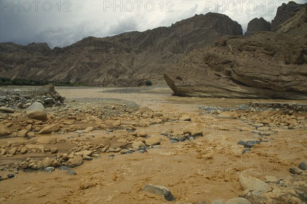 CHINA, Yellow River, Muddy waters flowing through rugged landscape