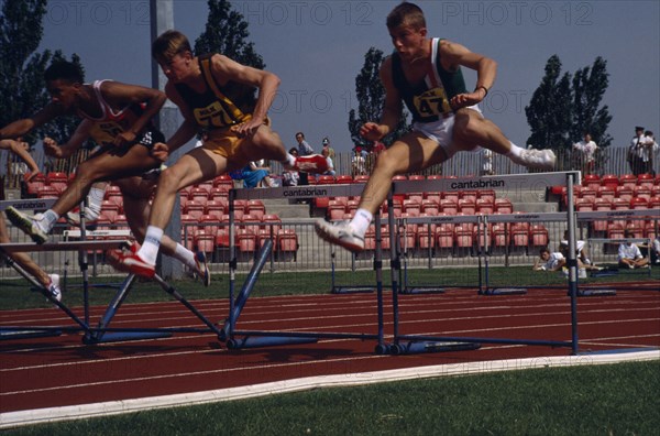 10048210 SPORT Athletics Hurdles Competitor in men s hurdles during school championships.