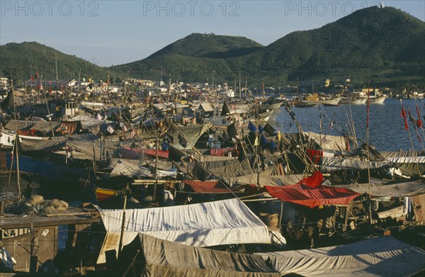 CHINA, Hainan Island, Sanya, The harbour with fishing boats moored alongside each other