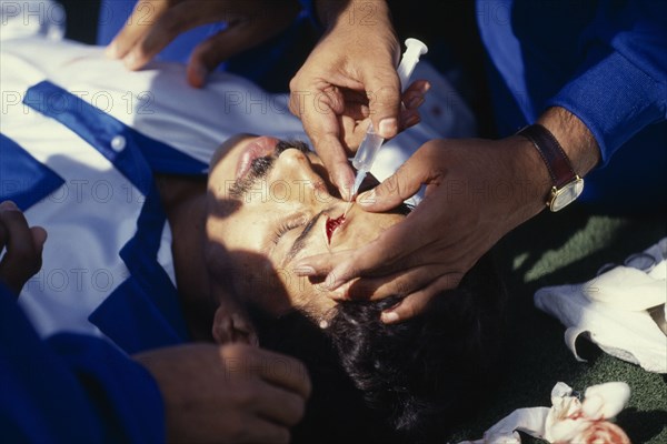 10044937 SPORT  Injuries  Hockey player receiving treatment during game betweeen India v England