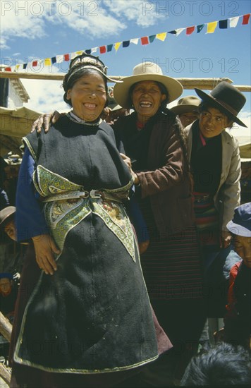 TIBET, Samye, People, Group of laughing women at Full Moon Festival
