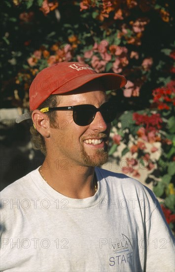 USA, People, Men, "Single American man  in baseball cap and sunglasses, head and shoulders three-quarter profile right. "