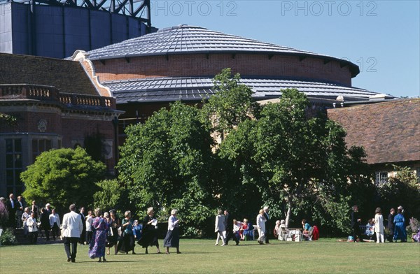 ENGLAND, East Sussex, Glyndebourne, "New theatre, exterior with audience members crossing the lawn in front."