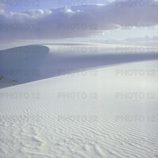 USA, New Mexico, White Sands, White sand dunes with clouds above