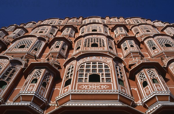 INDIA, Rajasthan, Jaipur, Palace of the Winds aka Hawa Mahal. View looking up the pink and white facade dating from 1799.