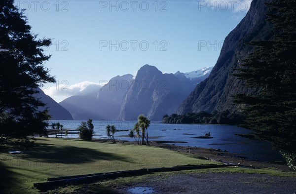 NEW ZEALAND, South Island, Milford Sound, View across water with mountains behind.