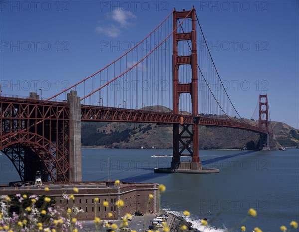 USA, California, San Fransisco, Golden Gate Bridge General view with fort below and hills in the background.