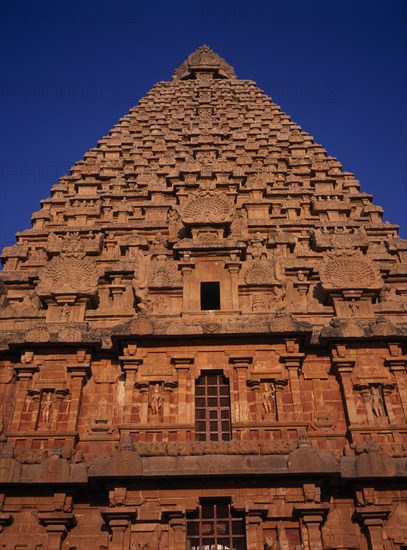 INDIA, Tamil Nadu , Thanjavur, Brihadishwara Temple part view of exterior with carved stonework.